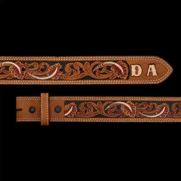 This Classic Western-Style Belt is beautifully crafted with an intricate tooling pattern and customizable tip for your initials or lettering. Crafted on high-quality top grain leather. This belt is double stitched. Detailed with a hand-painted base 